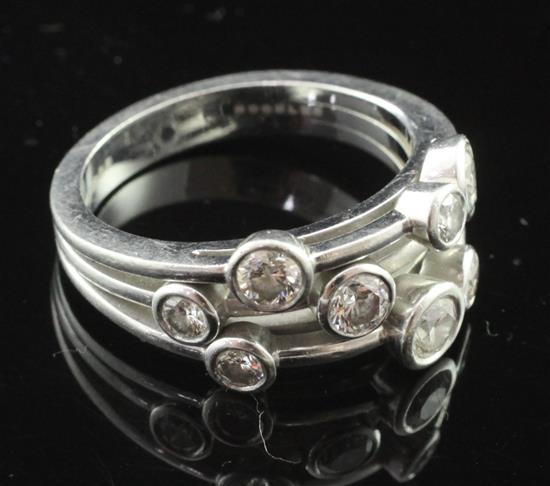 A Boodles modern platinum and nine stone diamond Rain Dance ring, size S.